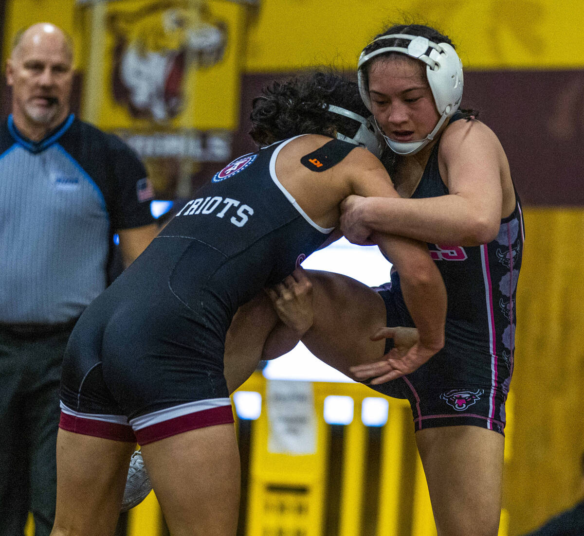 Liberty’s Chanity Faleto attempts to take down SLAM Academy’s Noelani Lutz during ...