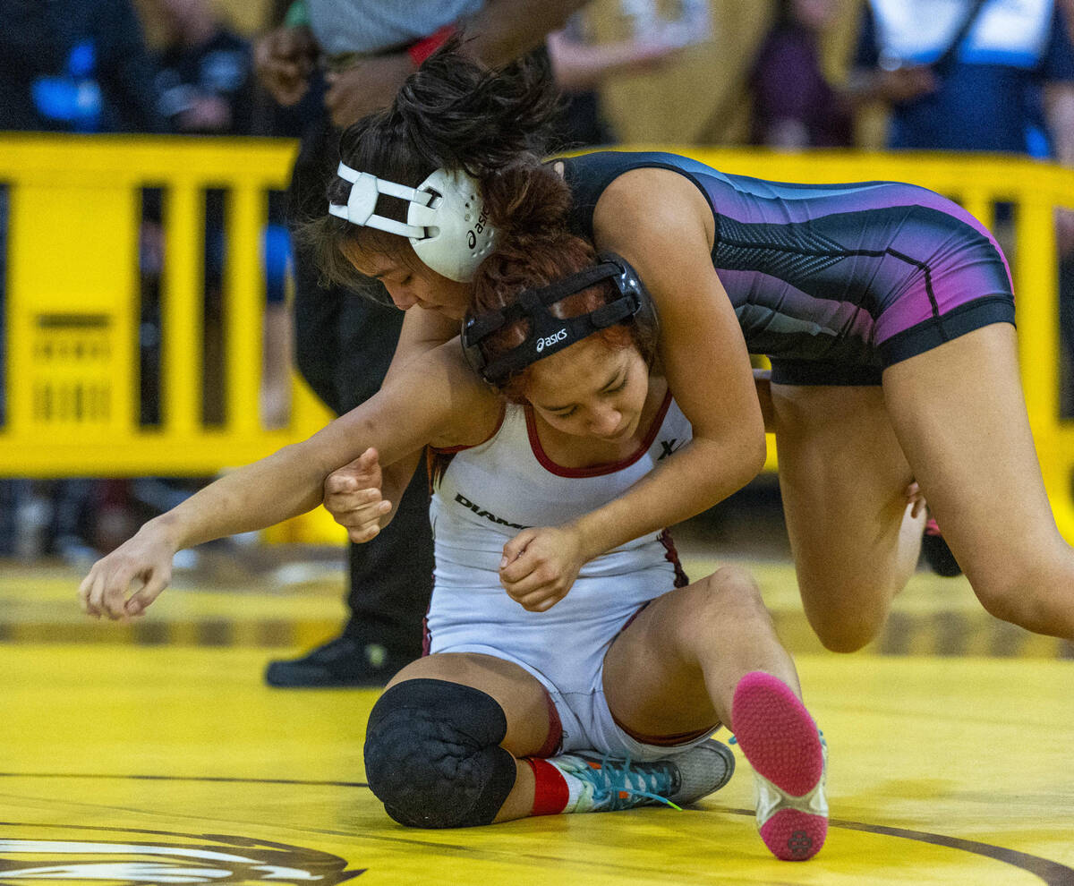 SLAM Academy’s Bertha Cabrera dominates Desert Oasis' Hazel Garcia during their 105 poun ...