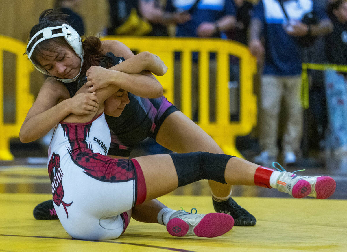 SLAM Academy’s Bertha Cabrera dominates Desert Oasis' Hazel Garcia during their 105 poun ...