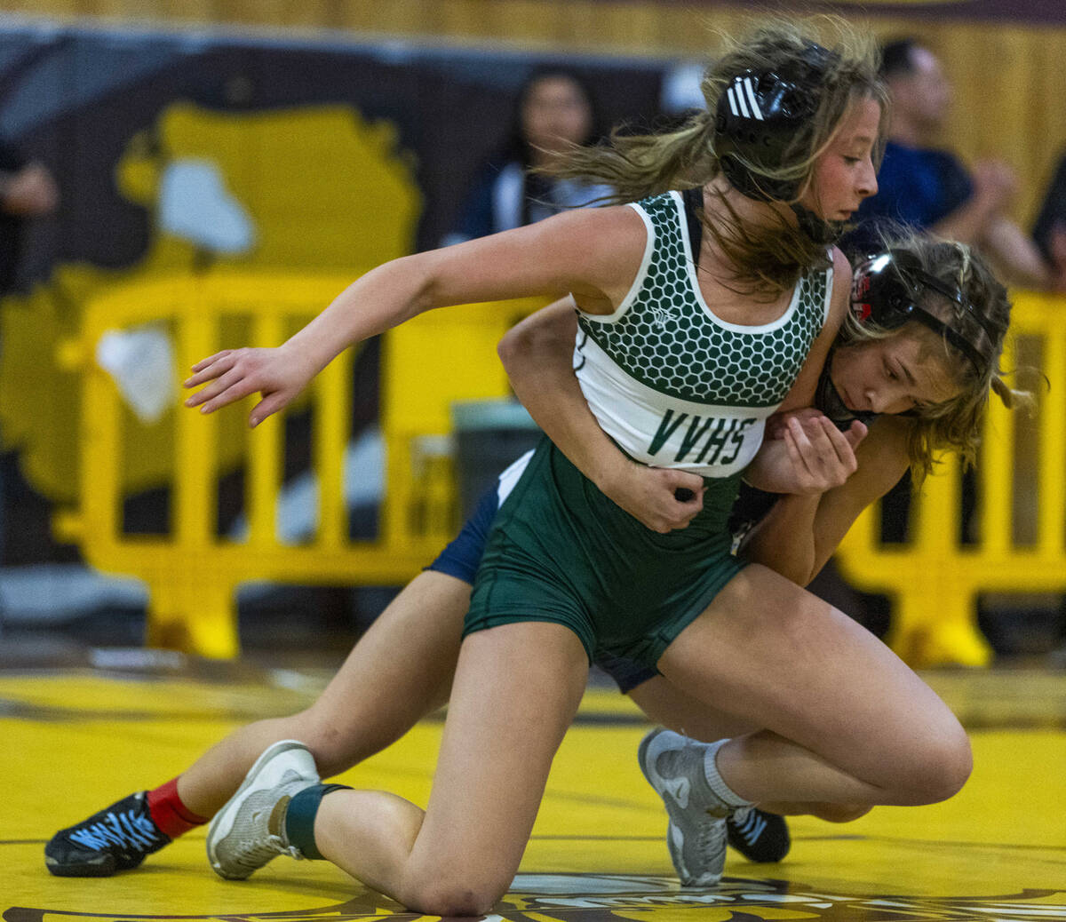 Virgin Valley’s Raylynn Woods is grabbed from behind by Centennial’s Tylene Tran ...