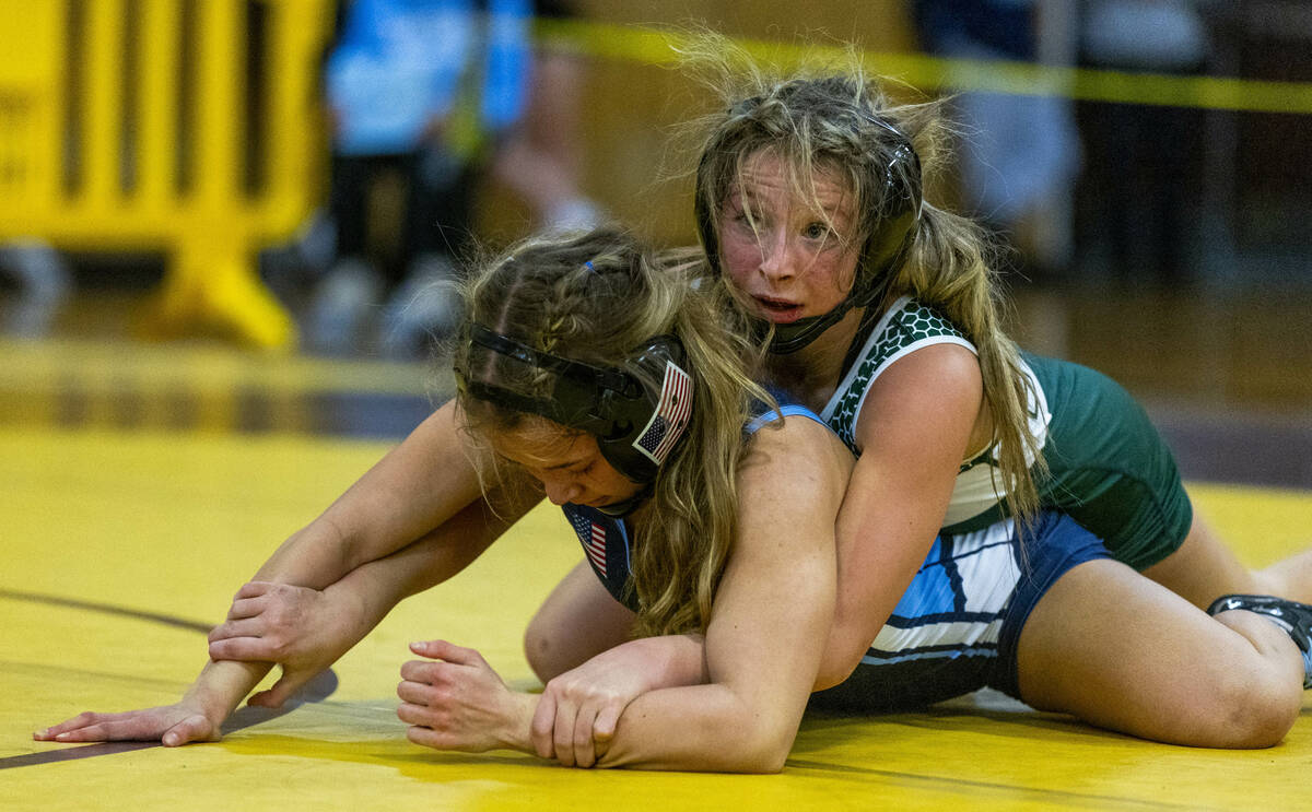 Virgin Valley’s Raylynn Woods looks for control over Centennial’s Tylene Tran dur ...