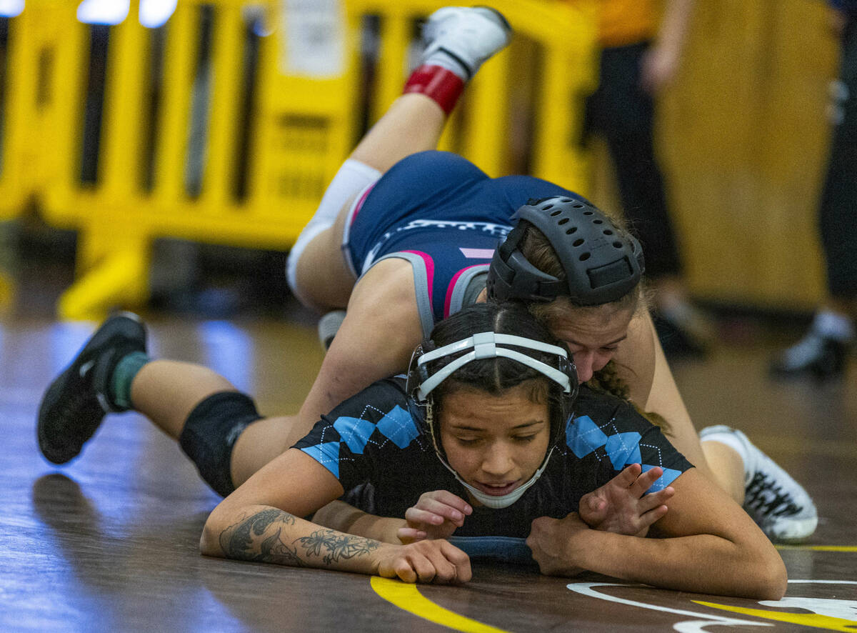 Shadow Ridge’s Makayla Power gets atop of Centennial’s Mya Bardoni during their 1 ...