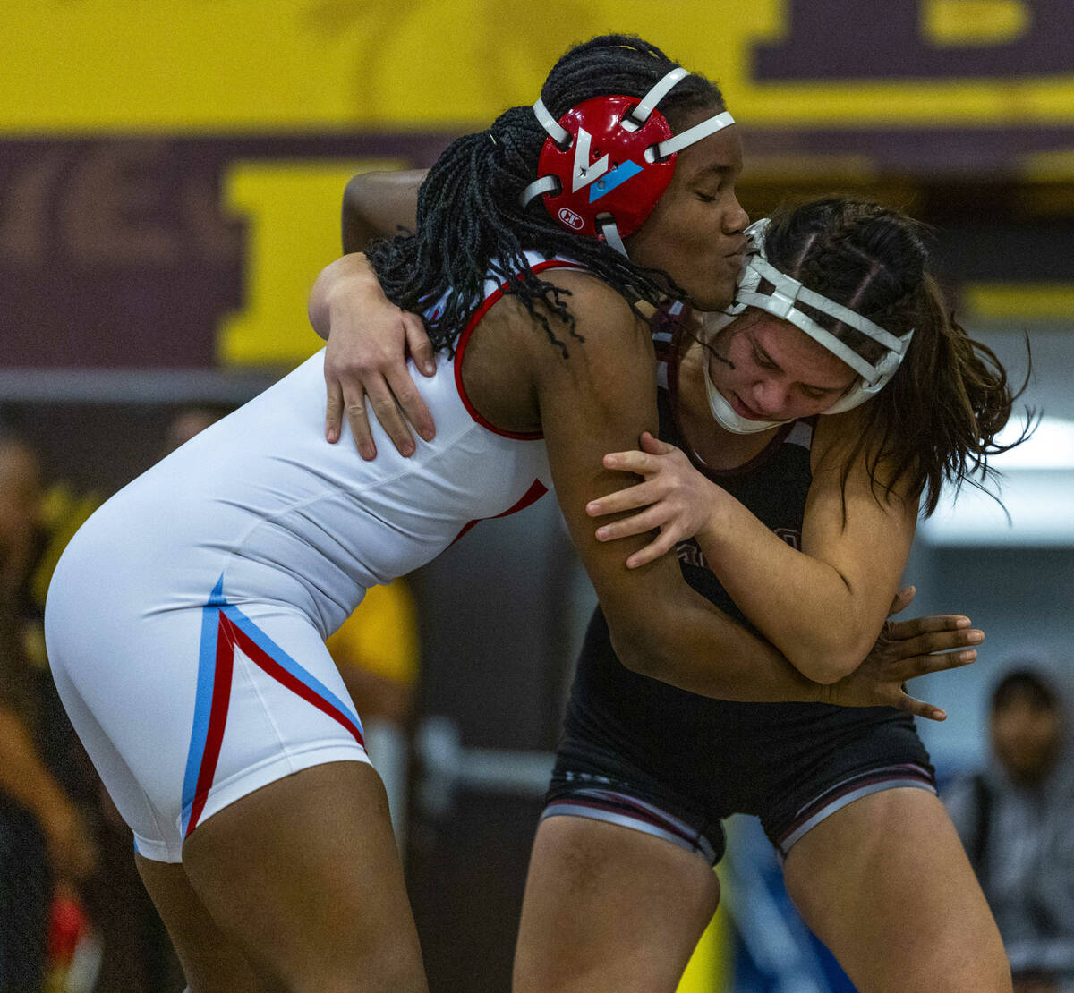 Western’s Jordan Hunter grapples with Cimarron-Memorial’s Addison Canja during th ...