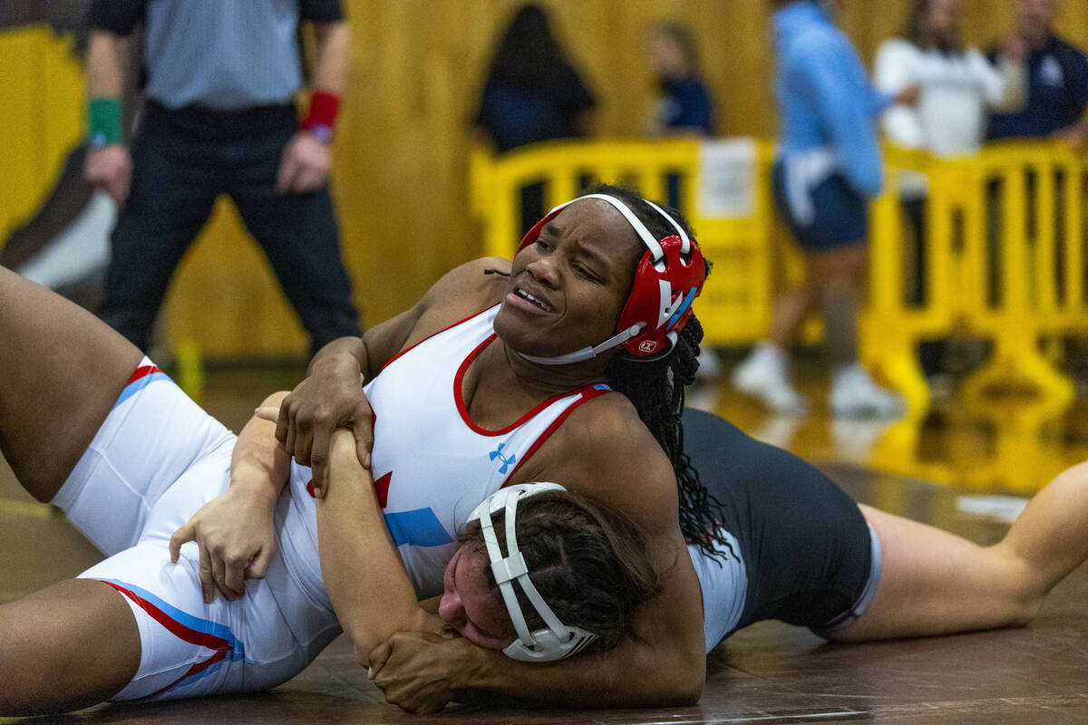 Western’s Jordan Hunter battles for control with Cimarron-Memorial’s Addison Canj ...