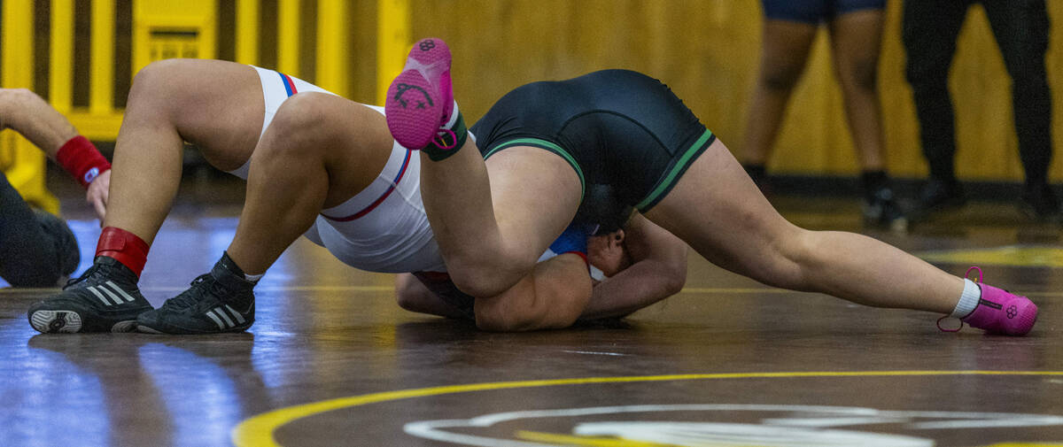 Green Valley’s Kaija Ashcroft quoicklys pin Valley’s Lady Josel Muro during their ...