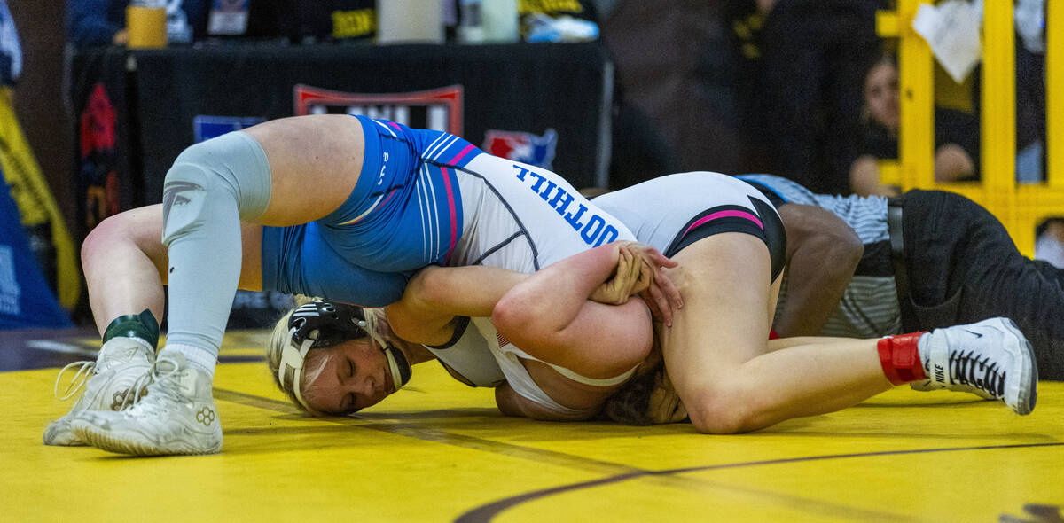 SLAM Academy’s Billie Bonwell bends over Foothill’s Savanna Abbott during their 1 ...