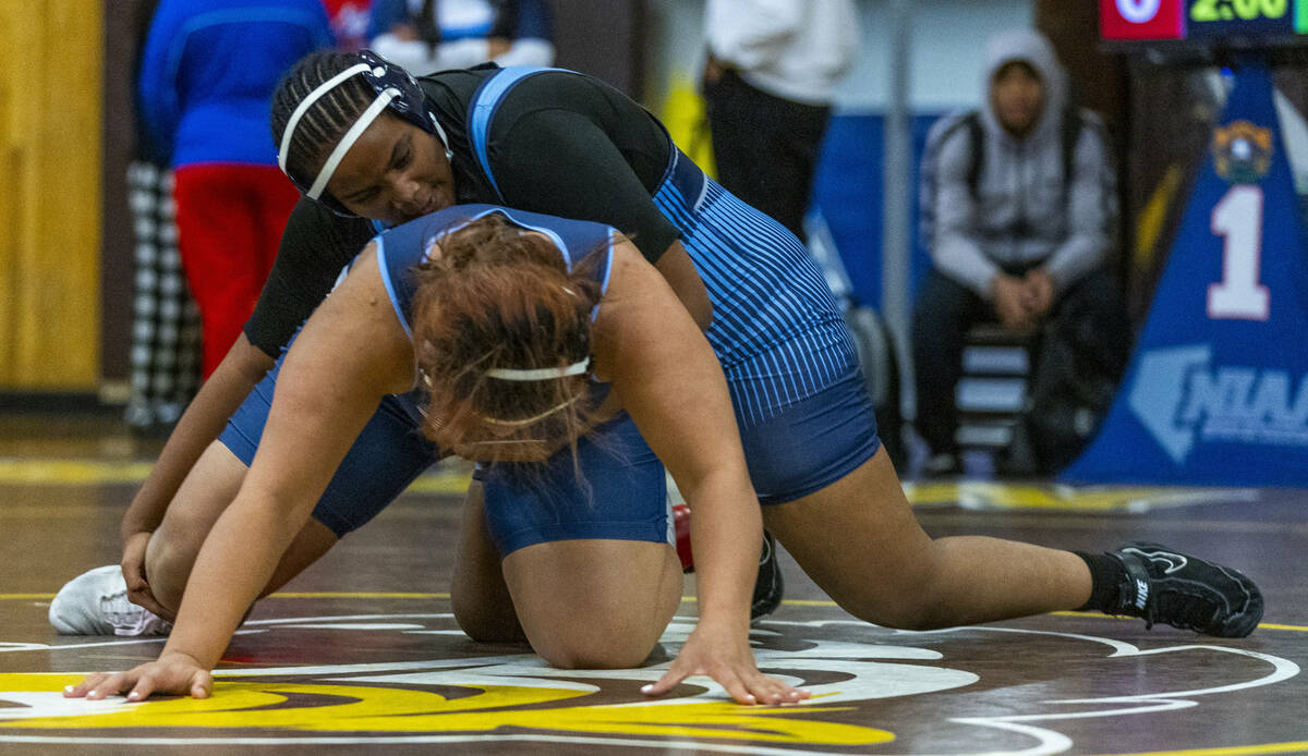 Canyon Springs’ Isabella Gray works to take Centennial’s Kitana Leafaatoto to the ...