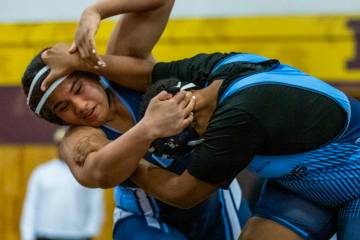 Centennial’s Kitana Leafaatoto battles with Canyon Springs’ Isabella Gray during their 235 ...