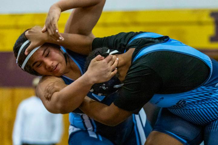 Centennial’s Kitana Leafaatoto battles with Canyon Springs’ Isabella Gray during their 235 ...