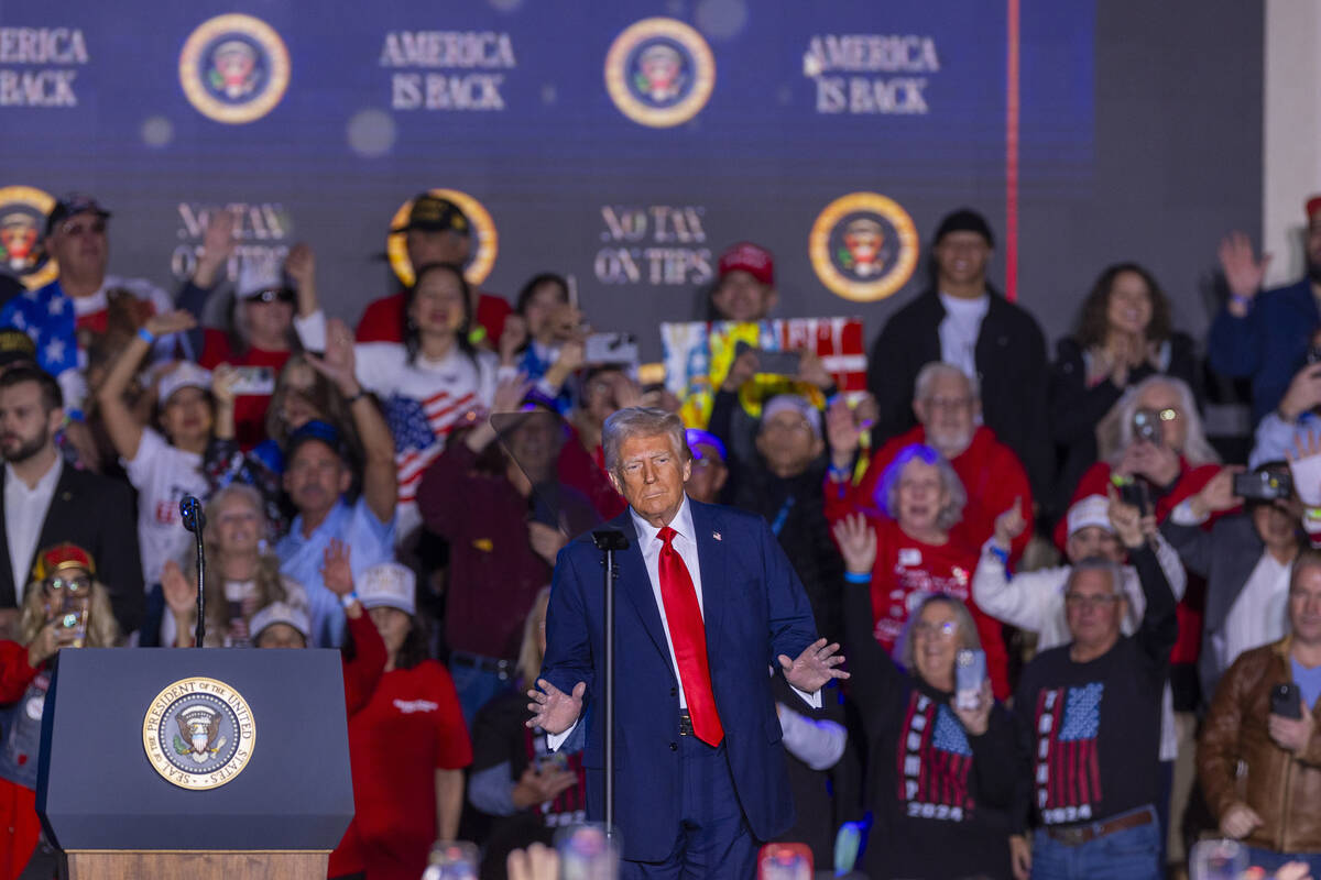 President Donald Trump dances with supporters after a speech at the Circa on Saturday, Jan. 25, ...