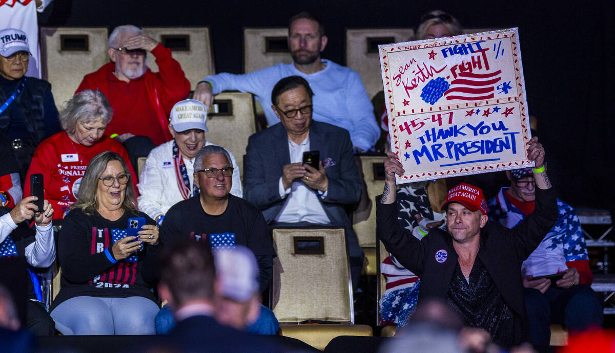 A supporter holds a thank you sign for President Donald Trump as he will be speakin at the Circ ...