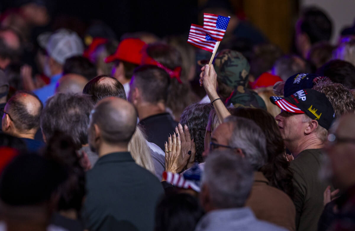 Flags are waved as President Donald Trump speaks to supporters at the Circa on Saturday, Jan. 2 ...