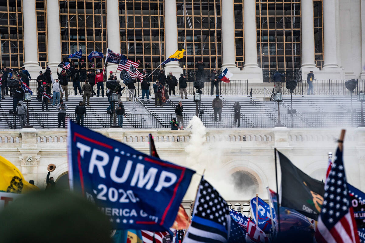 Supporters of U.S. President Donald Trump clash with the US Capitol police during a riot at the ...