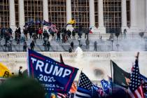 Supporters of US President Donald Trump clash with the US Capitol police during a riot at the U ...