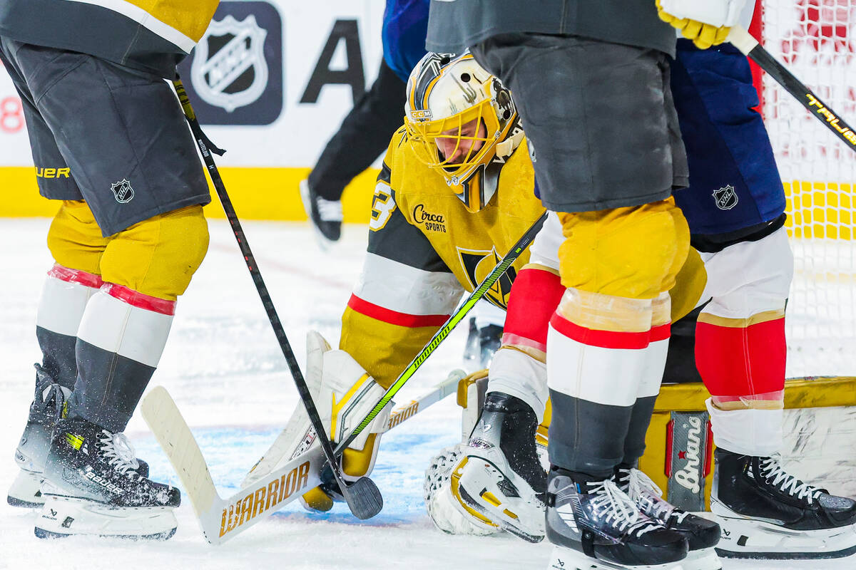 Golden Knights goaltender Adin Hill (33) makes a save during an NHL hockey game between the Gol ...