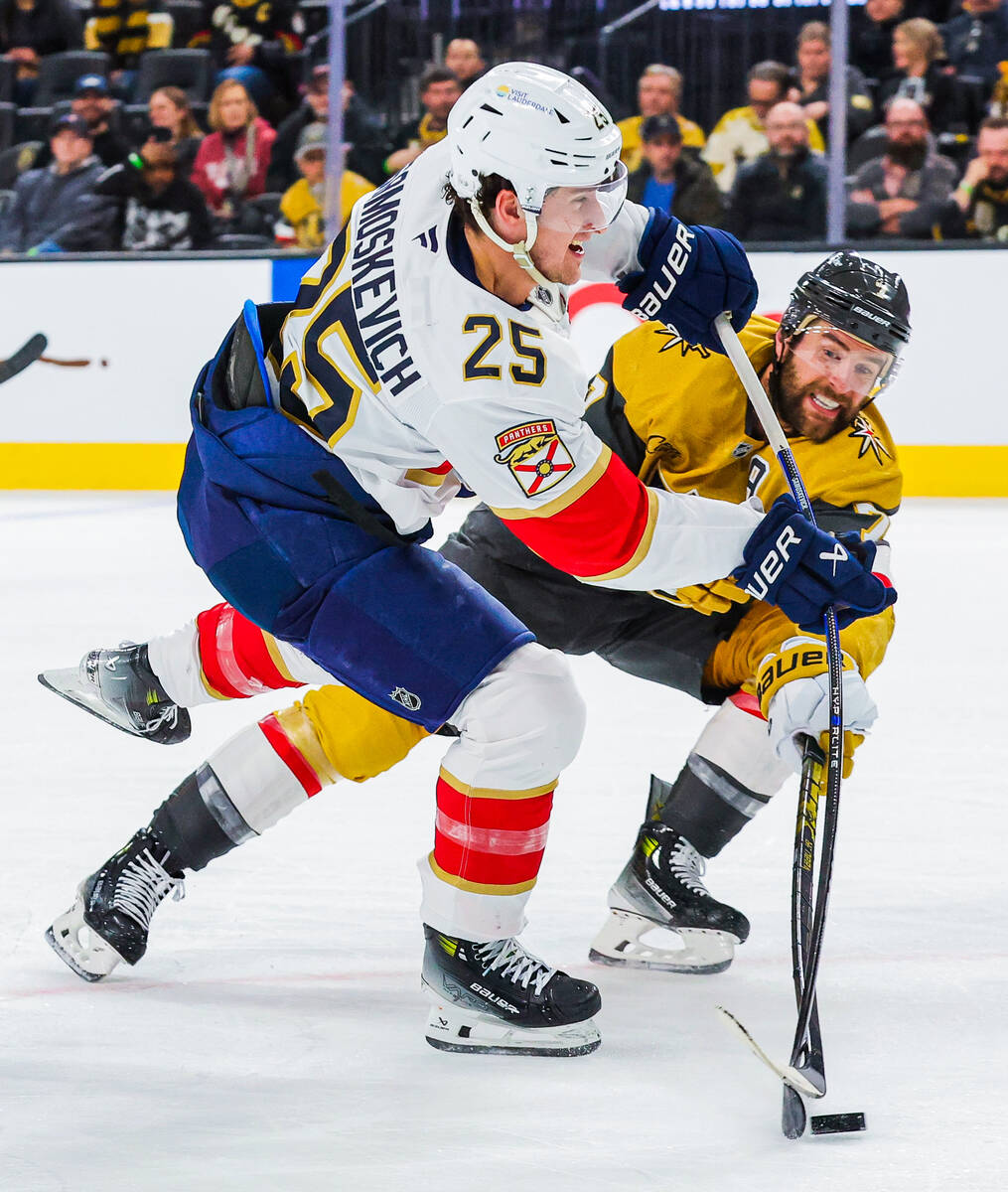 Golden Knights defenseman Alex Pietrangelo (7) defends as Florida Panthers right wing Mackie Sa ...