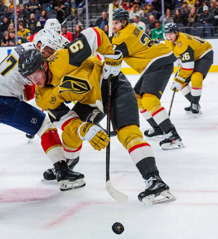 Golden Knights center Jack Eichel (9) lunges for the puck after a puck drop during an NHL hocke ...