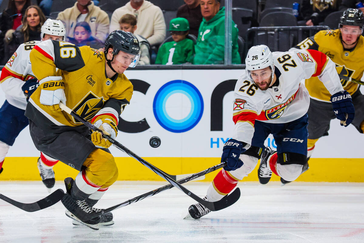 Golden Knights left wing Pavel Dorofeyev (16) and Florida Panthers defenseman Uvis Balinskis (2 ...