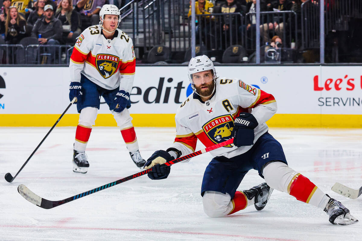 Florida Panthers defenseman Aaron Ekblad (5) slides on the ice during an NHL hockey game betwee ...