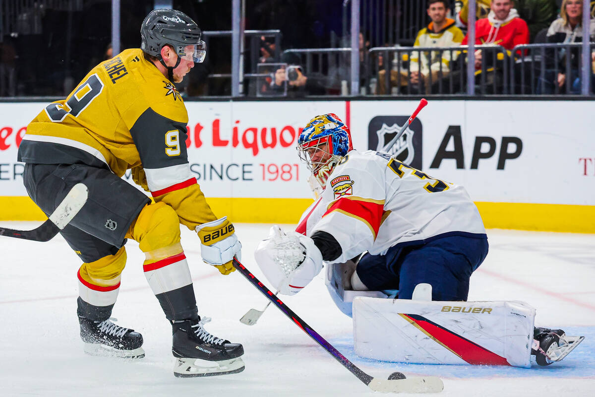 Golden Knights center Jack Eichel (9) passes up Florida Panthers goaltender Spencer Knight (30) ...