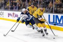 Golden Knights defenseman Alex Pietrangelo (7) takes the puck around the net during the second ...