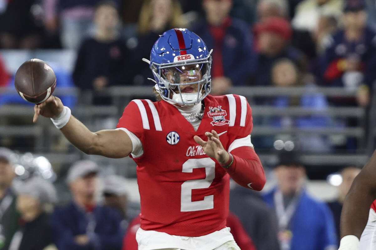 Mississippi quarterback Jaxson Dart (2) throws a pass during the first quarter of the Gator Bow ...