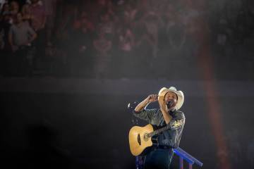 Garth Brooks performs before the crowd at Allegiant Stadium on Friday, July 10 2021, in Las Veg ...