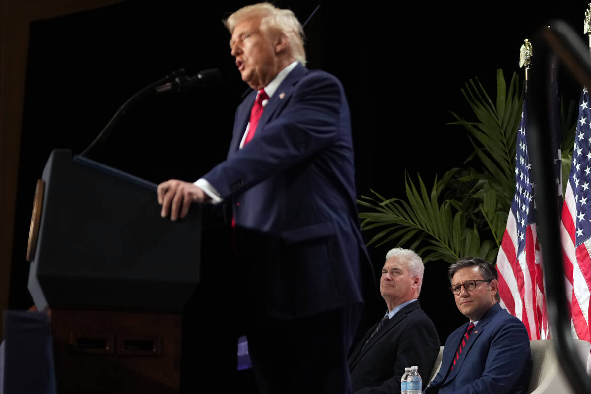 Rep. Tom Emmer, R-Minn., and House Speaker Mike Johnson of La., listen as President Donald Trum ...