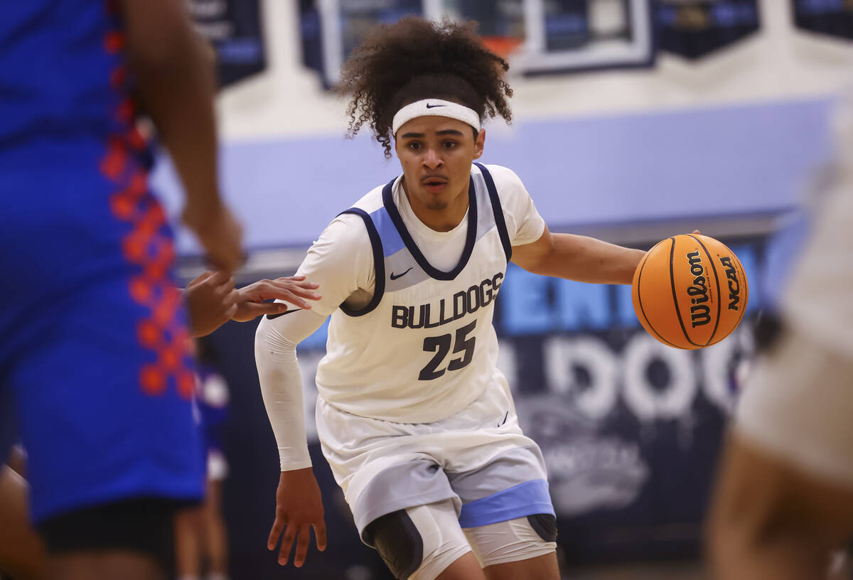 Centennial's Jayonni Durrough (25) brings the ball up court against Bishop Gorman during a bask ...