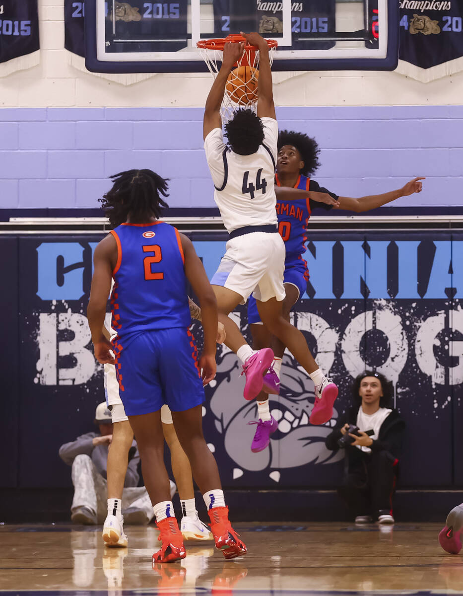 Centennial's Bryce Iwuoha (44) dunks the ball against Bishop Gorman guard Nick Jefferson (10) d ...