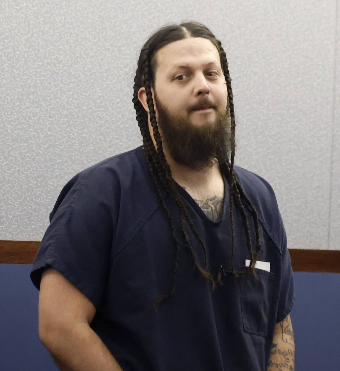 Christian Scarlett appears in court during a hearing at the Regional Justice Center, on Tuesday ...