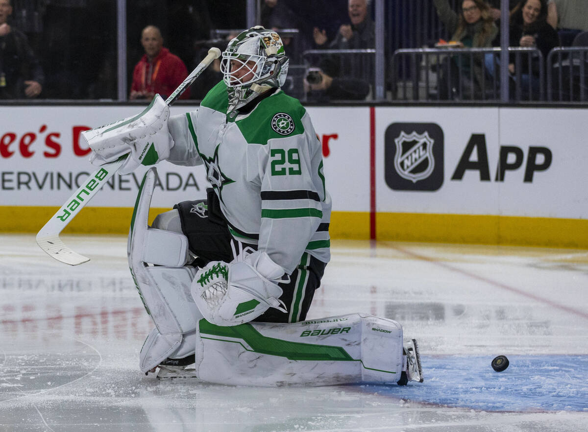 Dallas Stars goaltender Jake Oettinger (29) has a puck slide past for a Golden Knights score du ...