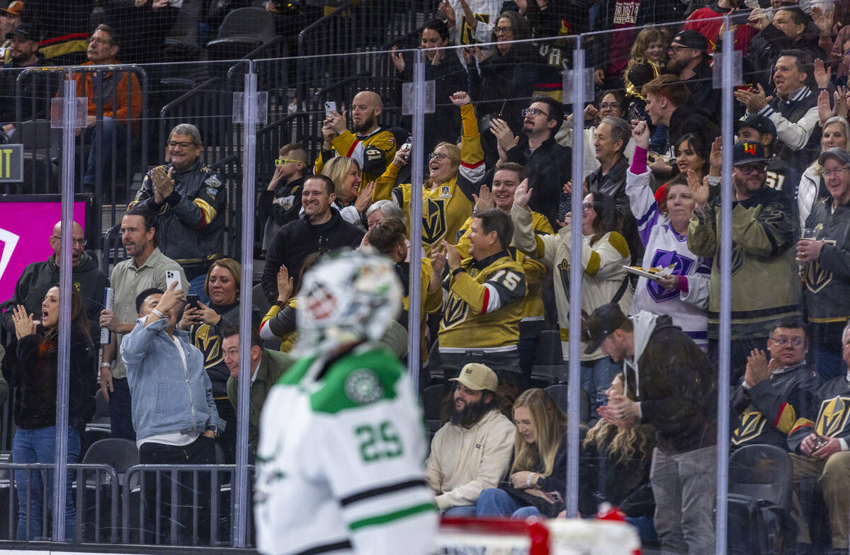 Golden Knights fans celebrate an early score against then Dallas Stars during the first period ...