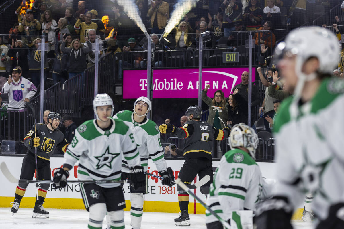 Golden Knights center Jack Eichel (9) celebrates a goal with center Ivan Barbashev (49) against ...