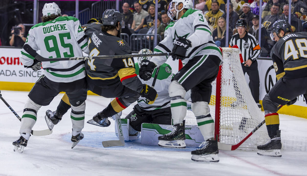 Golden Knights defenseman Nicolas Hague (14) and center Tomas Hertl (48) team up for a score ag ...