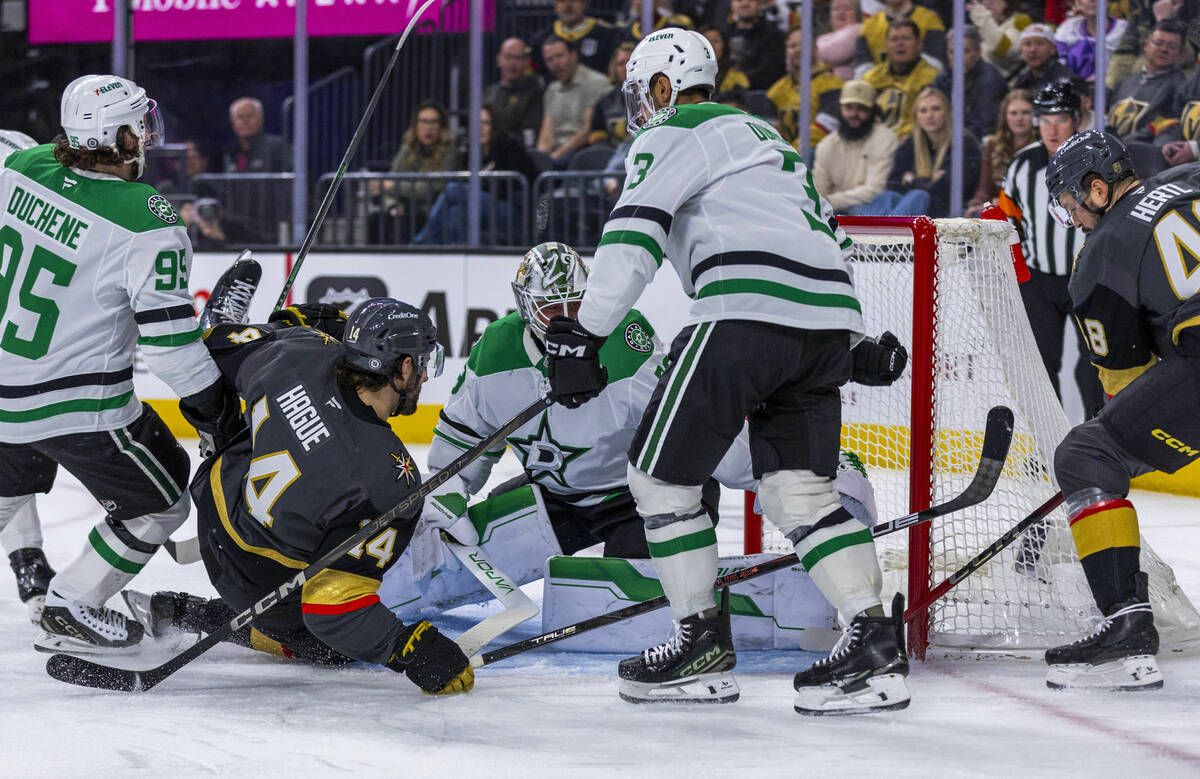 Golden Knights defenseman Nicolas Hague (14) and center Tomas Hertl (48) team up for a score ag ...