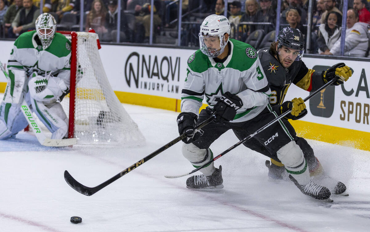 Dallas Stars defenseman Mathew Dumba (3) and Golden Knights center Raphael Lavoie (36) battles ...