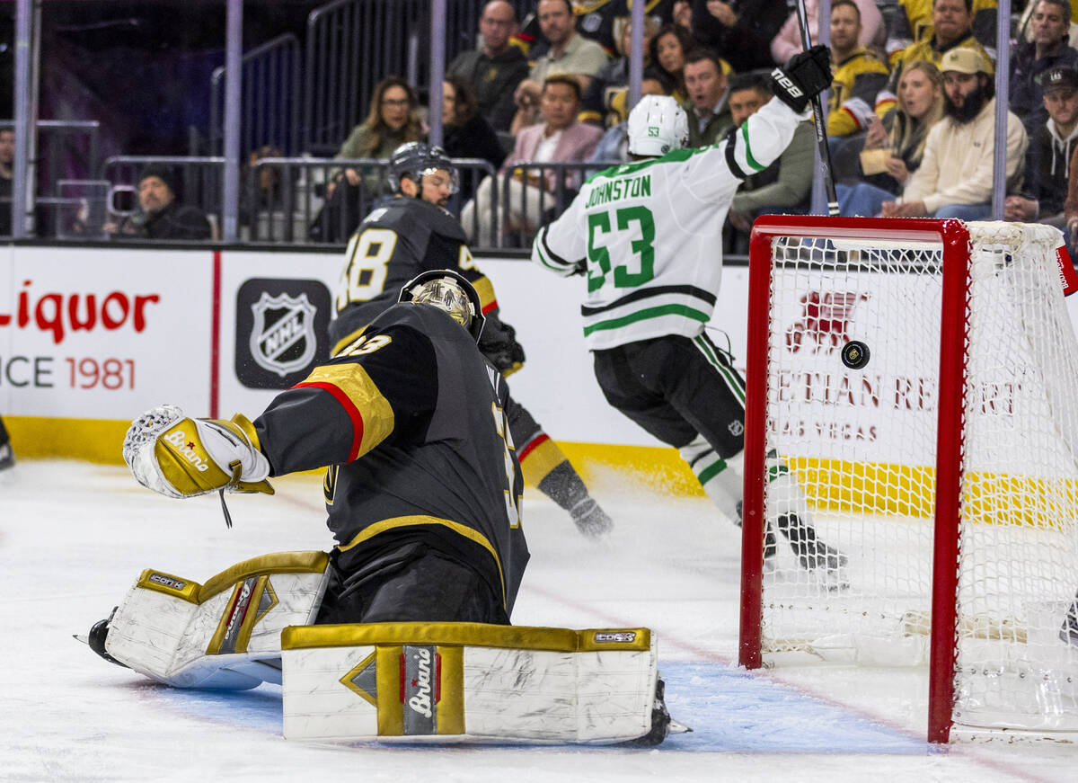 Golden Knights goaltender Adin Hill (33) is unable to stop a goal shot by Dallas Stars center W ...