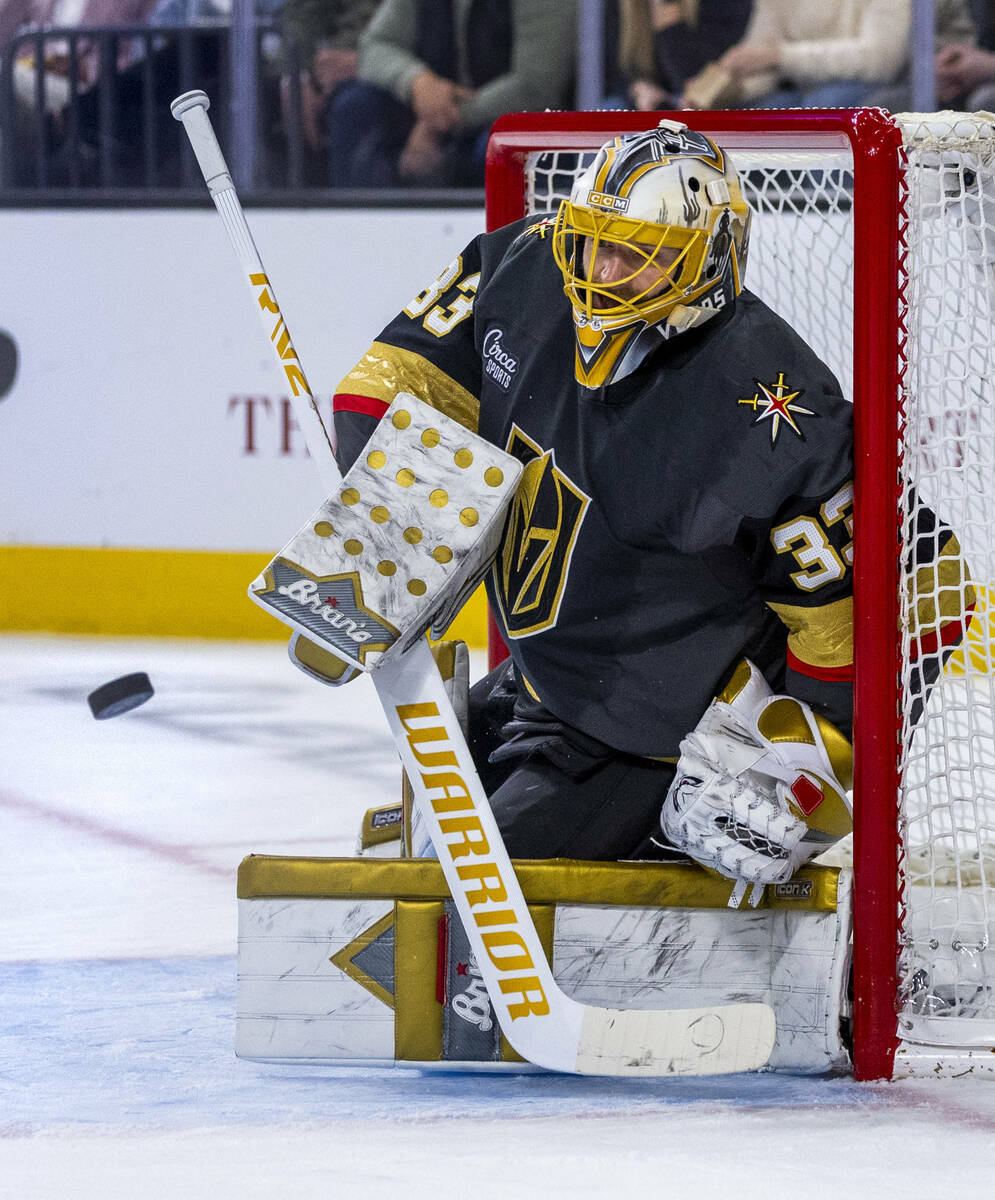 Golden Knights goaltender Adin Hill (33) deflects as shot against the Dallas Stars during the s ...