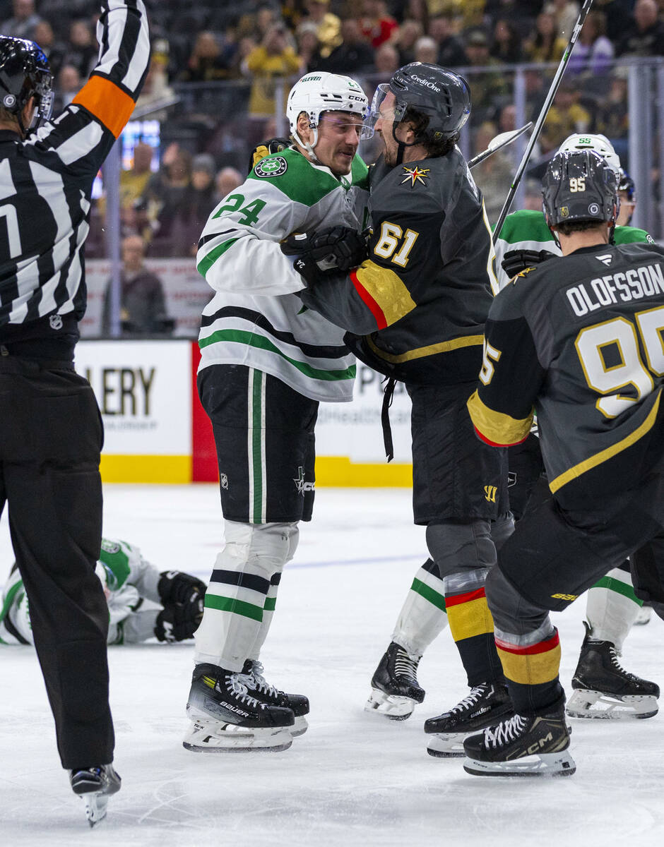 Golden Knights right wing Mark Stone (61) looks to fend off a fight initiated by Dallas Stars c ...