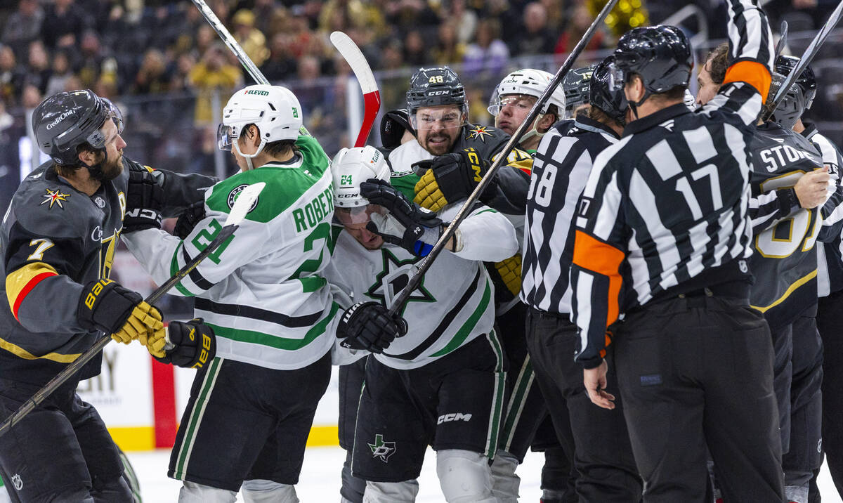 Golden Knights center Tomas Hertl (48) looks to great Dallas Stars center Roope Hintz (24) as b ...