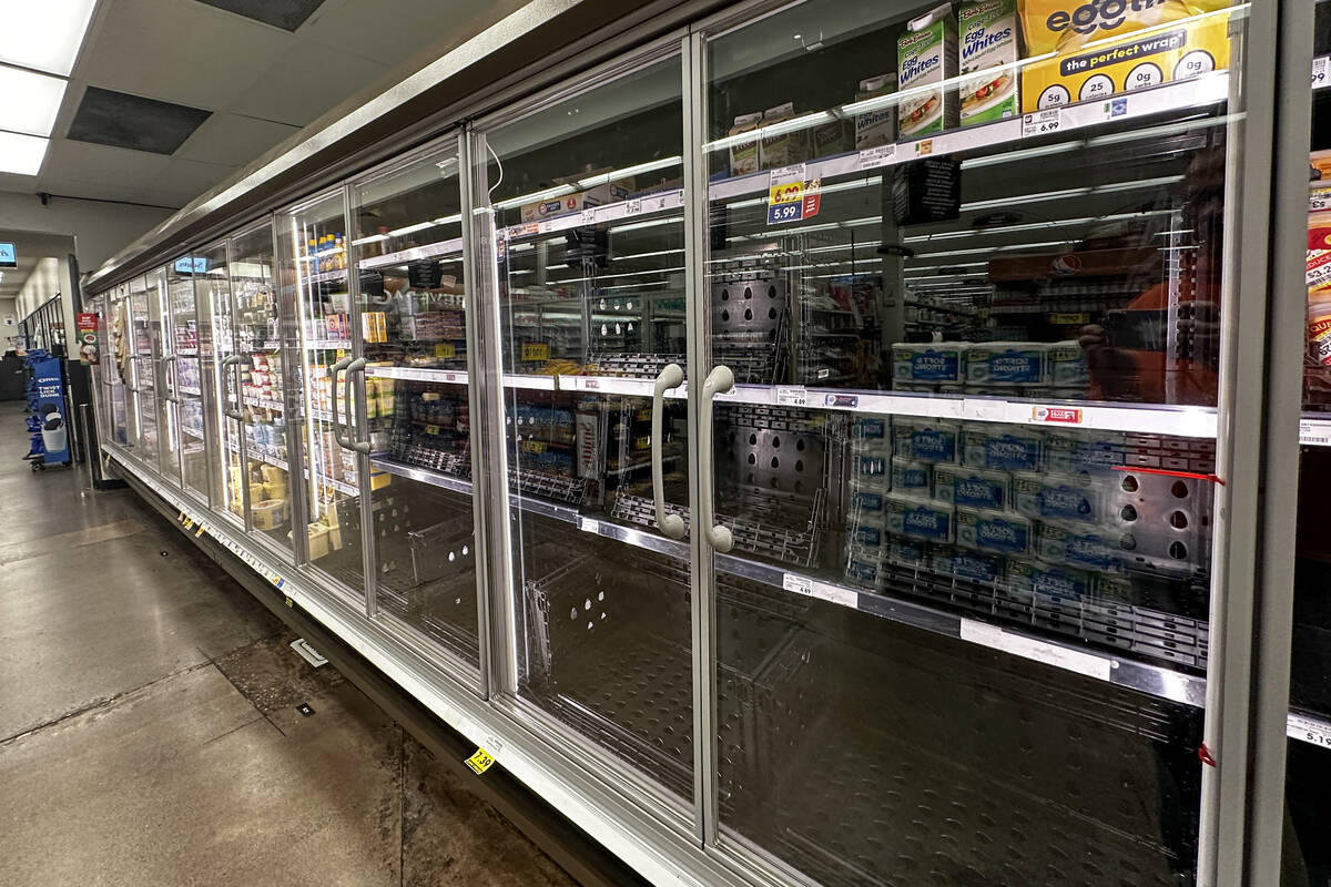 A refrigerated section that is normally stocked with eggs sits empty at a Las Vegas Smith&#x201 ...