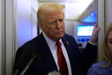 President Donald Trump speaks to reporters aboard Air Force One en route from Miami to Joint Ba ...