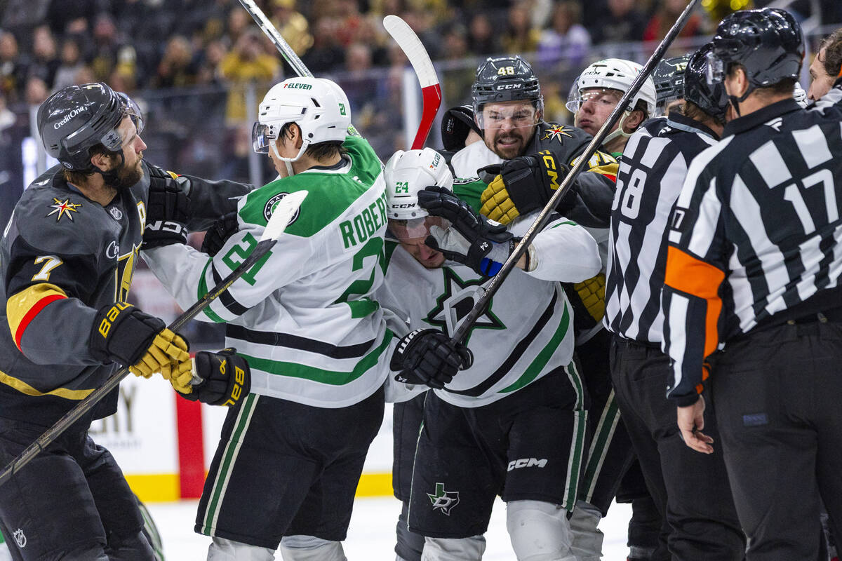 Golden Knights center Tomas Hertl (48) looks to great Dallas Stars center Roope Hintz (24) as b ...