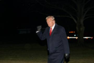 President Donald Trump waves as he walks from Marine One upon arrival on the South Lawn of the ...