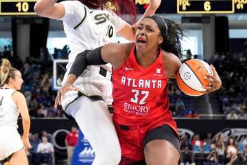 Atlanta Dream's Cheyenne Parker-Tyus drives to the basket in a WNBA basketball game against the ...