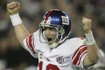 New York Giants quarterback Eli Manning reacts after throwing the game-winning touchdown pass t ...