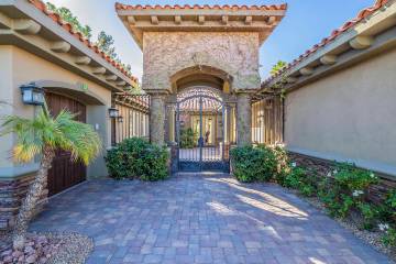 This newly listed custom, single-story home in the SouthShore community at Lake Las Vegas is be ...