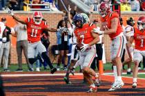 American team wide receiver Jack Bech (7), of TCU, celebrates with teammates after scoring the ...