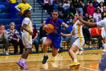 Bishop Gorman guard Aaliah Spaight (10) splits the defense of Democracy Prep guard Bray'ana Mil ...